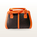 Orange and black ostrich grain leather handbag with twin handles, three quarter view