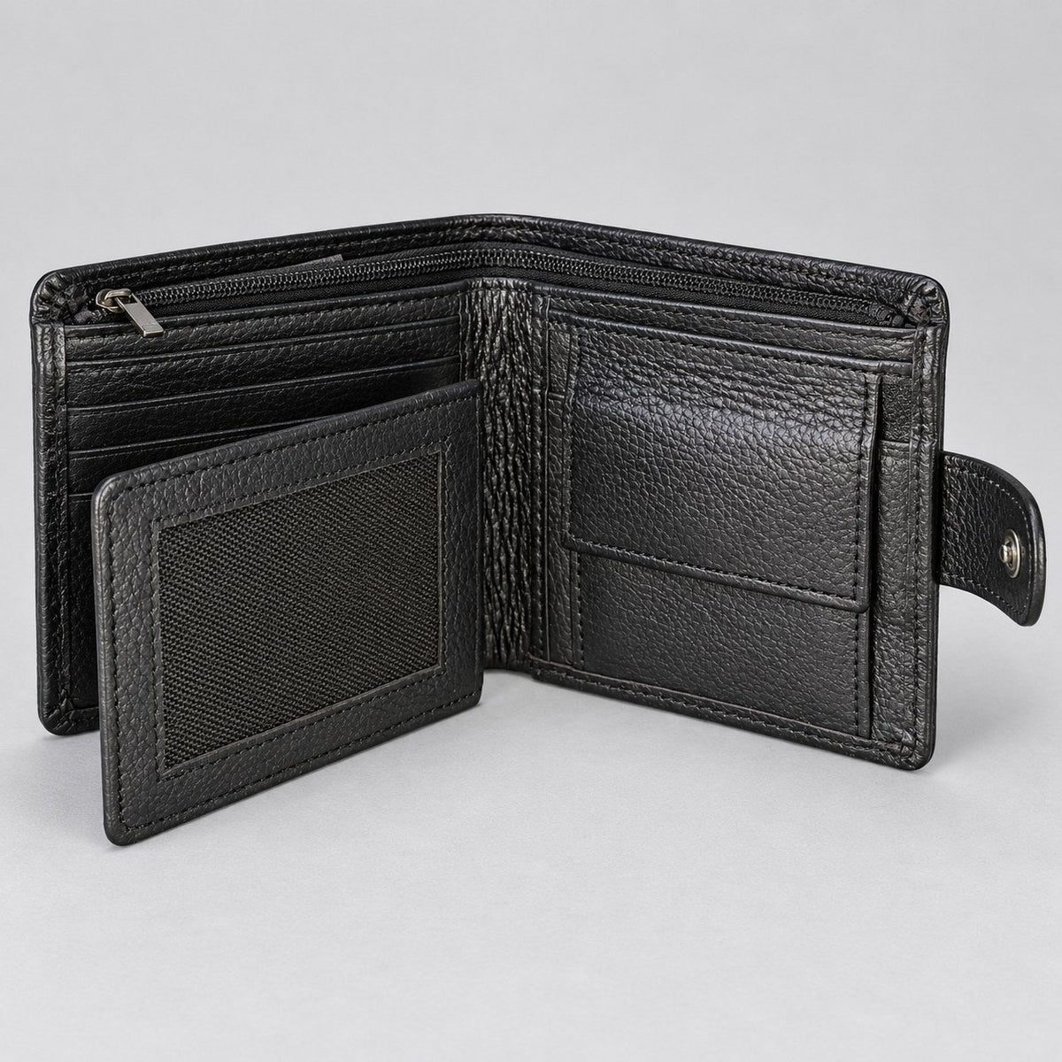 Black grain bifold wallet open, showing the zipped coin pocket and centre flap