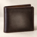 Men's dark brown leather bifold wallet with tan stitching, closed front view