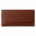 Brown leather envelope wallet with a rounded flap, closed