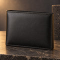Men's black leather bifold wallet with centre flap, closed front view